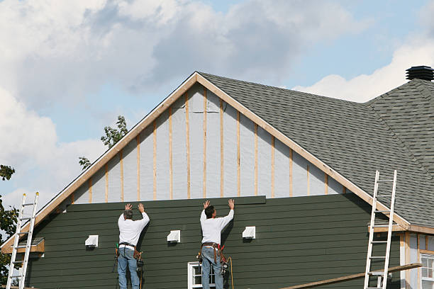 Professional Storm Damage Siding Repair technician working in Centreville, MD